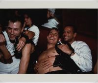 Nan Goldin, Clemens, Jens and Nicolas Laughing at
Le Pulp, Paris, 1999 © Nan Goldin. Courtesy of Nan
Goldin and Gagosian