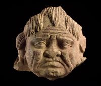 Head of a grimacing yaksha, about 2nd 
or 3rd century